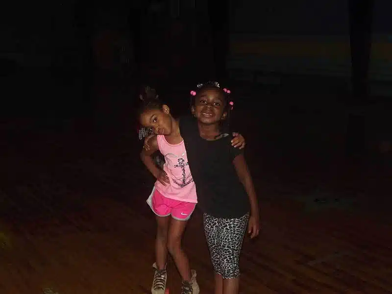 Best friends at the roller skating rink.