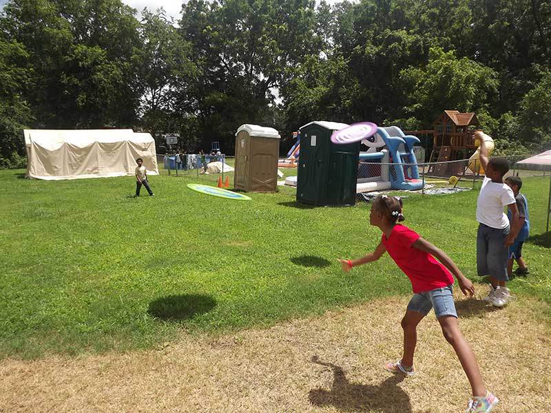 Playing frisbee at summer camp.