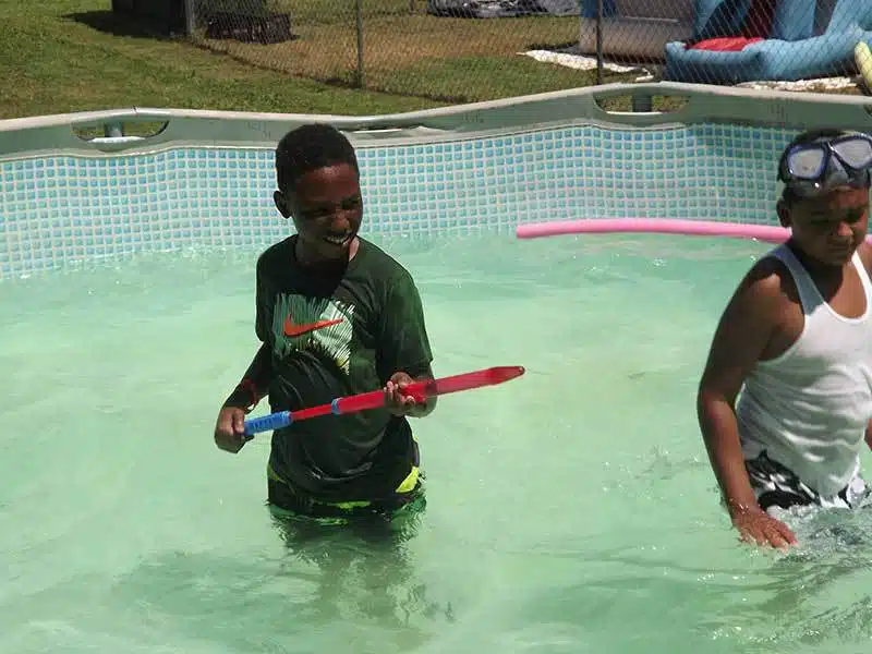 Playing in the pool this summer.